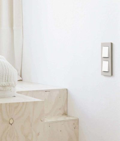 Gira Esprit Linoleum Plywood Light Grey switch in bedroom